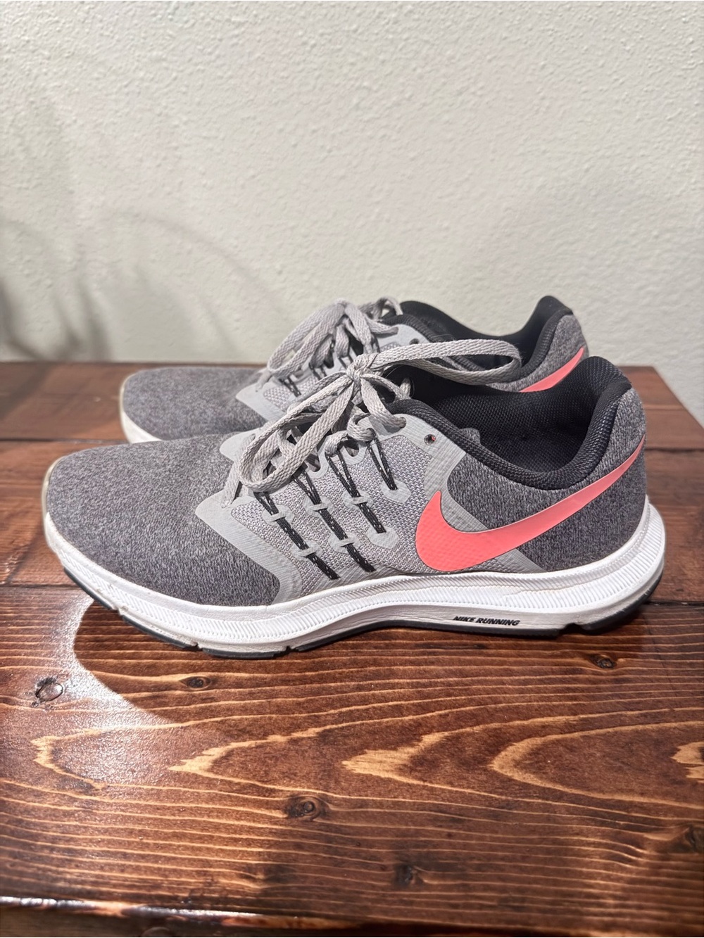Nike Women's Gray Athletic Sneakers with Pink Swoosh